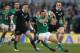DUBLIN, IRELAND - NOVEMBER 24: Rob Kearney of Ireland holds onto the ball as Cory Jane (L) and Israel Dagg look on during the International match between Ireland and New Zealand All Blacks at the Aviva Stadium on November 24, 2013 in Dublin, Ireland. (P