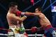 MACAU - NOVEMBER 24: Manny Pacquiao (R) of the Philippines punches Brandon Rios of the U.S. during their 'Clash in Cotai' WBO International Welterweight title fight on November 24, 2013 in Macau. (Photo by Nicky Loh/Getty Images)