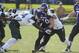 EVANSTON, IL - NOVEMBER 23: Dan Vitale #40 of the Northwestern Wildcats is tackled by Taiwan Jones #34 of the Michigan State Spartans during the first half on November 23, 2013 at Ryan Field in Evanston, Illinois. (Photo by David Banks/Getty Images)