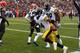 CLEVELAND, OH - NOVEMBER 24: Wide receiver Antonio Brown #84 of the Pittsburgh Steelers celebrates after scoring a touchdown with Jerricho Cotchery #89 as defenders Tashaun Gipson #39 and Joe Haden #23 of the Cleveland Browns look on at FirstEnergy Stadi
