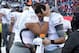TUCSON, AZ - NOVEMBER 23: Quarterback Marcus Mariota #8 of the Oregon Ducks is hugged by defensive tackle Ricky Havili-Heimuli #90 on the sidelines during the final moments of the college football game against the Arizona Wildcats at Arizona Stadium on N
