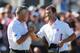 MELBOURNE, AUSTRALIA - NOVEMBER 17: Adam Scott of Australia is congratulated by his caddie Steve Williams on the 18th hole as he wins the tournament during round four of the 2013 Australian Masters at Royal Melbourne Golf Course on November 17, 2013 in M