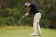 MELBOURNE, AUSTRALIA - NOVEMBER 15: Adam Scott of Australia makes a putt during round two of the 2013 Australian Masters at Royal Melbourne Golf Course on November 15, 2013 in Melbourne, Australia. (Photo by Graham Denholm/Getty Images)