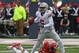 CHAMPAIGN, IL - NOVEMBER 16: Braxton Miller #5 of the Ohio State Buckeyes shakes off a tackle attempt by Zane Petty #21 of the Illinois Fighting Illini at Memorial Stadium on November 16, 2013 in Champaign, Illinois. (Photo by Jonathan Daniel/Getty Images