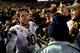 PASADENA, CA - NOVEMBER 23: Taylor Kelly #10 of the Arizona State Sun Devils celebrates a 38-33 win over the UCLA Bruins with fans in the endzone at Rose Bowl on November 23, 2013 in Pasadena, California. (Photo by Harry How/Getty Images)