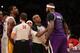 LOS ANGELES, CA - NOVEMBER 24: DeMarcus Cousins #15 of the Sacramento Kings and Shawne Williams #3 of the Los Angeles Lakers exchange words during an altercation in the game at Staples Center on November 24, 2013 in Los Angeles, California. The Lakers wo