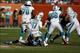 Nov 24, 2013; Miami Gardens, FL, USA; Miami Dolphins quarterback Ryan Tannehill (17) is sacked by Carolina Panthers outside linebacker Thomas Davis (58) in the second half of a game at Sun Life Stadium. Mandatory Credit: Robert Mayer-USA TODAY Sports