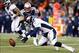 Nov 24, 2013; Foxborough, MA, USA; Denver Broncos quarterback Peyton Manning (18) fumbles the ball in front of New England Patriots linebacker Dane Fletcher (52) in the third quarter at Gillette Stadium. Mandatory Credit: David Butler II-USA TODAY Sports
