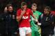 MANCHESTER, ENGLAND - NOVEMBER 10: Nemanja Vidic of Manchester United is helped from the pitch after sustaining an injury during the Barclays Premier League match between Manchester United and Arsenal at Old Trafford on November 10, 2013 in Manchester, E