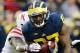 ANN ARBOR, MI - NOVEMBER 09: Derrick Green #27 of the Michigan Wolverines breaks a tackle in the second quarter against the Nebraska Cornhuskers at Michigan Stadium on November 9, 2013 in Ann Arbor, Michigan. (Photo by Gregory Shamus/Getty Images)