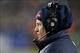Nov 24, 2013; Foxborough, MA, USA; New England Patriots head coach Bill Belichick watches from the sidelines during overtime against the Denver Broncos at Gillette Stadium Stadium. Mandatory Credit: Greg M. Cooper-USA TODAY Sports