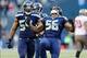 Nov 3, 2013; Seattle, WA, USA; Seattle Seahawks defensive end Cliff Avril (56) celebrates after recording a sack during the game Tampa Bay Buccaneers at CenturyLink Field. Seattle defeated Tampa Bay 27-24. Mandatory Credit: Steven Bisig-USA TODAY Sports