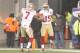Dec 16, 2012; Foxborough, MA, USA; San Francisco 49ers wide receiver Michael Crabtree (15) reacts after his touchdown with teammate quarterback Colin Kaepernick (7) as they take on the New England Patriots during the fourth quarter at Gillette Stadium. Th