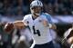 OAKLAND, CA - NOVEMBER 24: Ryan Fitzpatrick #4 of the Tennessee Titans drops back to pass against the Oakland Raiders during the first quarter at O.co Coliseum on November 24, 2013 in Oakland, California. (Photo by Thearon W. Henderson/Getty Images)
