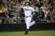 SAN DIEGO, CA - SEPTEMBER 6: Chase Headley #7 of the San Diego Padres points skyward after hitting a solo home run during the ninth inning of a baseball game against the Colorado Rockies at Petco Park on September 6, 2013 in San Diego, California. (Phot