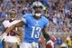 DETROIT, MI - NOVEMBER 24: Nate Burleson #13 of the Detroit Lions celebrates after scoring a touchdown on an 11 yard pass from quarterback Matthew Stafford #9 during the game against the Tampa Bay Buccaneers at Ford Field on November 24, 2013 in Detroit,
