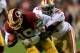 LANDOVER, MD - NOVEMBER 25: Quarterback Robert Griffin III #10 of the Washington Redskins is sacked by outside linebacker Aldon Smith #99 of the San Francisco 49ers during the third quarter at FedExField on November 25, 2013 in Landover, Maryland. (Photo