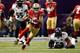 NEW ORLEANS, LA - FEBRUARY 03: Michael Crabtree #15 of the San Francisco 49ers runs for yards after the catch past Ray Lewis #52 of the Baltimore Ravens during Super Bowl XLVII at the Mercedes-Benz Superdome on February 3, 2013 in New Orleans, Louisiana.