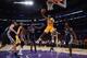 LOS ANGELES, CA - NOVEMBER 15: Jodie Meeks #20 of the Los Angeles Lakers drives to the basket for a lay up between Zach Randolph (L) #50 and Tony Allen #9 of the Memphis Grizzlies in the first half at Staples Center on November 15, 2013 in Los Angeles, C