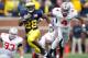 ANN ARBOR, MI - NOVEMBER 26: Fitzgerald Toussaint #28 of the Michigan Wolverines takes off for a long second quarter run in front of C.J. Barnett #4 of the Ohio State Buckeyes at Michigan Stadium on November 26, 2011 in Ann Arbor, Michigan. (Photo by Gre