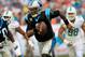 MIAMI GARDENS, FL - NOVEMBER 24: Cam Newton #1 of the Carolina Panthers runs the ball in the second quarter against the Miami Dolphins at Sun Life Stadium on November 24, 2013 in Miami Gardens, Florida. (Photo by Chris Trotman/Getty Images)
