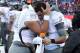 TUCSON, AZ - NOVEMBER 23: Quarterback Marcus Mariota #8 of the Oregon Ducks is hugged by defensive tackle Ricky Havili-Heimuli #90 on the sidelines during the final moments of the college football game against the Arizona Wildcats at Arizona Stadium on N