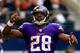 ARLINGTON, TX - NOVEMBER 03: Running back Adrian Peterson #28 of the Minnesota Vikings celebrates after a touchdown during the game against the Dallas Cowboys at Cowboys Stadium on November 3, 2013 in Arlington, Texas. (Photo by Jamie Squire/Getty Image