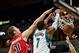 Oct 12, 2013; Minneapolis, MN, USA; Minnesota Timberwolves power forward Derrick Williams (7) dunks while defended by Toronto Raptors power forward Tyler Hansbrough (50) in the second quarter at Target Center. Raptors won 104-97. Mandatory Credit: Greg Sm