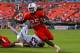MIAMI GARDENS, FL - NOVEMBER 23: Dallas Crawford #25 of the Miami Hurricanes rushes fora touchdown during a game against the Virginia Cavaliers at Sun Life Stadium on November 23, 2013 in Miami Gardens, Florida. (Photo by Mike Ehrmann/Getty Images)