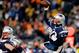 FOXBORO, MA - NOVEMBER 24: Quarterback Tom Brady #12 of the New England Patriots passes against the Denver Broncos during a game at Gillette Stadium on November 24, 2013 in Foxboro, Massachusetts. (Photo by Jim Rogash/Getty Images)