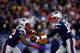 FOXBORO, MA - NOVEMBER 24: Quarterback Tom Brady #12 hands off to running back Stevan Ridley #22 of the New England Patriots against the Denver Broncos during a game at Gillette Stadium on November 24, 2013 in Foxboro, Massachusetts. (Photo by Jared Wick