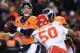 DENVER, CO - NOVEMBER 17: Quarterback Peyton Manning #18 of the Denver Broncos drops back to pass as tackle Orlando Franklin #74 of the Denver Broncos blocks outside linebacker Justin Houston #50 of the Kansas City Chiefs at Sports Authority Field at Mil