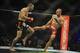 Jan 12, 2013; Oklahoma City, OK, USA; Nate Marquardt (black shorts) and Tarec Saffiedine (red and black shorts) in their Strikeforce MMA Welterweight Title bout at the Chesapeake Energy Arena. Mandatory Credit: Mark D. Smith-USA TODAY Sports