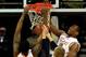 KANSAS CITY, MO - NOVEMBER 25: Prince Ibeh #44 of the Texas Longhorns dunks over Nate Austin #33 of the Brigham Young Cougars as Jonathan Holmes #10 looks on during the CBE Hall Of Fame Classic game at the Sprint Center on November 25, 2013 in Kansas Cit
