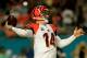 MIAMI GARDENS, FL - OCTOBER 31: Andy Dalton #14 of the Cincinnati Bengals attempts to pass the ball against the Miami Dolphins at Sun Life Stadium on October 31, 2013 in Miami Gardens, Florida. (Photo by Chris Trotman/Getty Images)
