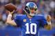 EAST RUTHERFORD, NJ - NOVEMBER 10: Eli Manning #10 of the New York Giants passes against the Oakland Raiders during their game at MetLife Stadium on November 10, 2013 in East Rutherford, New Jersey. (Photo by Al Bello/Getty Images)