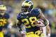 Oct 19, 2013; Ann Arbor, MI, USA; Michigan Wolverines running back Fitzgerald Toussaint (28) running the ball in for a touchdown in the third quarter against the Indiana Hoosiers at Michigan Stadium. Mandatory Credit: Rick Osentoski-USA TODAY Sports