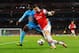 LONDON, ENGLAND - NOVEMBER 26: Nicolas Nkoulou of Marseille and Olivier Giroud of Arsenal compete for the ball during the UEFA Champions League Group F match between Arsenal and Olympique de Marseille at Emirates Stadium on November 26, 2013 in London, E