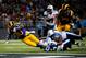 Nov 3, 2013; St. Louis, MO, USA; St. Louis Rams running back Zac Stacy (30) scores on a nine yard run as Tennessee Titans strong safety George Wilson (21) and defensive tackle Jurrell Casey (99) defend during the second half at the Edward Jones Dome. Tenn