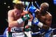 LAS VEGAS, NV - SEPTEMBER 14: (L-R) Floyd Mayweather Jr. throws a right to Canelo Alvarez during their WBC/WBA 154-pound title fight at the MGM Grand Garden Arena on September 14, 2013 in Las Vegas, Nevada. (Photo by Al Bello/Getty Images)