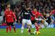 CARDIFF, WALES - NOVEMBER 24: Peter Whittingham of Cardiff (c) is fouled by Tom Cleverley of Manchester United (r) during the Barclays Premier League match between Cardiff City and Manchester United at Cardiff City Stadium on November 24, 2013 in Cardiff