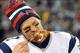 Nov 22, 2012; East Rutherford, NJ, USA; New England Patriots quarterback Tom Brady (12) takes a bite of turkey drumstick after the game against the New York Jets on Thanksgiving at Metlife Stadium. The Patriots won the game 49-19. Mandatory Credit: Joe Ca