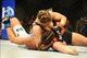 Feb 23, 2013; Anaheim, CA, USA; Ronda Rousey (black shorts) and Liz Carmouche (white shorts) fight during their UFC women's world bantamweight championship bout at the Honda Center. Mandatory Credit: Jayne Kamin-Oncea-USA TODAY Sports