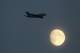 LONDON, ENGLAND - SEPTEMBER 20: A Singapore Airlines A380 aeroplane flies past the moon during the 4th NatWest One Day International between England and Pakistan at Lord's on September 20, 2010 in London, England. (Photo by Richard Heathcote/Getty Images
