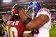 December 3, 2012; Landover, MD, USA; New York Giants defensive tackle Chris Canty (99) congratulates Washington Redskins quarterback Robert Griffin III (10) after their game at FedEx Field. Mandatory Credit: Geoff Burke-USA TODAY Sports