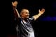 LONDON, ENGLAND - JANUARY 1: Phil Taylor celebrates winning the tenth set against Michael van Gerwen of the Netherlands during the final of the 2013 Ladbrokes.com World Darts Championship at the Alexandra Palace on January 1, 2013 in London, England. (Pho