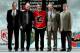 COLUMBUS, OH - JUNE 22: 24th overall pick Mikael Backlund of the Calgary Flames poses with team personnel after being drafted in the first round of the 2007 NHL Entry Draft at Nationwide Arena on June 22, 2007 in Columbus, Ohio. (Photo by Bruce Bennett/