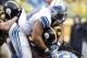 Nov 17, 2013; Pittsburgh, PA, USA; Detroit Lions defensive tackle Ndamukong Suh (90) and free safety Louis Delmas (right) tackle Pittsburgh Steelers running back Felix Jones (middle) during the second quarter at Heinz Field. Mandatory Credit: Charles LeCl