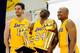 EL SEGUNDO, CA - SEPTEMBER 25: Kobe Bryant #24 of the Los Angeles Lakers laughs as he holds two NBA Finals Larry O'Brien Championship Trophy's as he poses for a photograph with teammates Pau Gasol #16 and Derek Fisher #2 during Media Day at the Toyota C