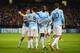 MANCHESTER, ENGLAND - NOVEMBER 27: Samir Nasri of Manchester City celebrates scoring his team's second goal with Jesus Navas and Yaya Toure during the UEFA Champions League Group D match between Manchester City and FC Viktoria Plzen at Etihad Stadium on